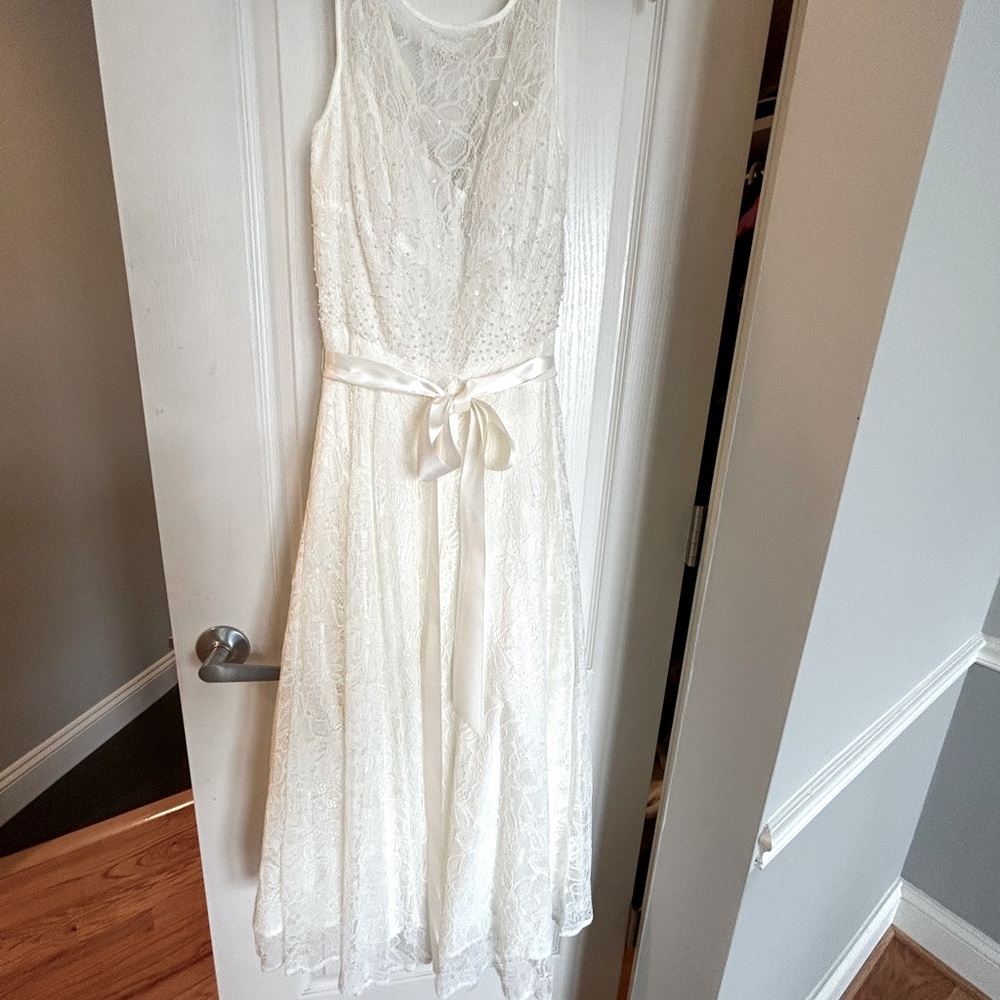 Bridal dress. Lovely ivory color  with small white pearls on bodice.
